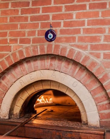cooking in a brick oven pizza